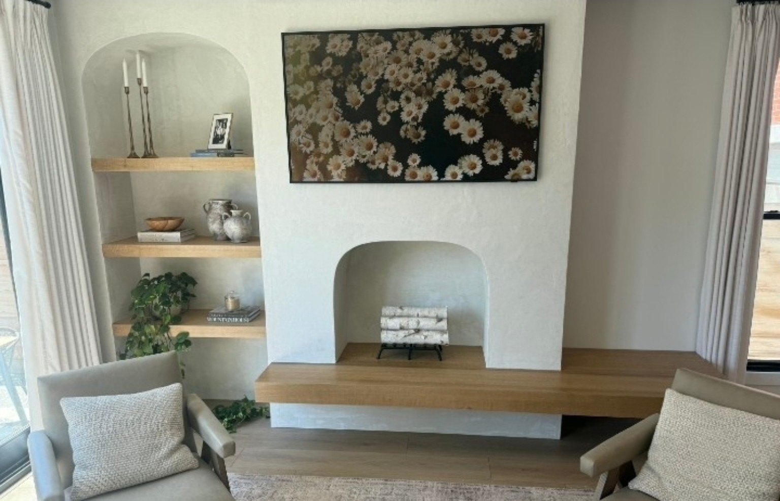 Custom white fireplace wall with white oak floating bench and shelves