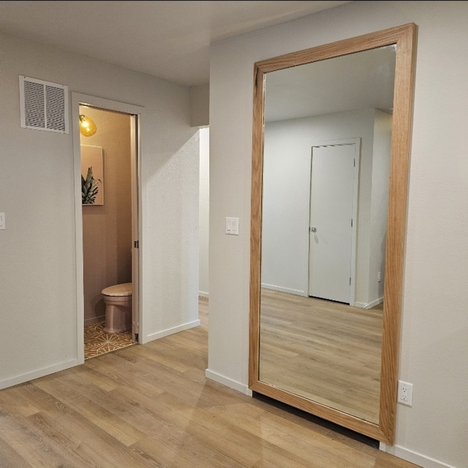 Large floor mirror with custom wood frame
