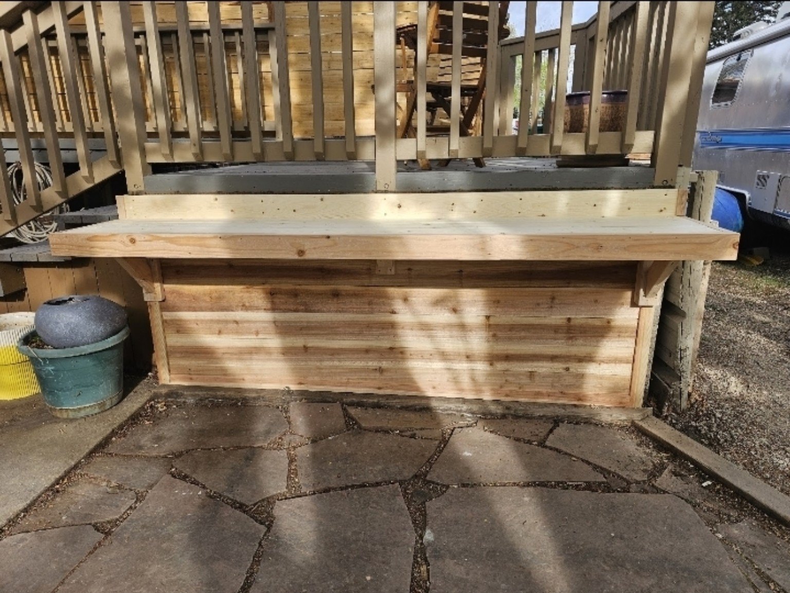 Custom wood bench built into an outdoor deck