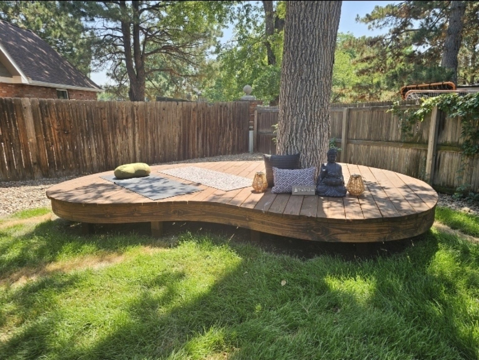 Sculptural custom deck built around a mature tree