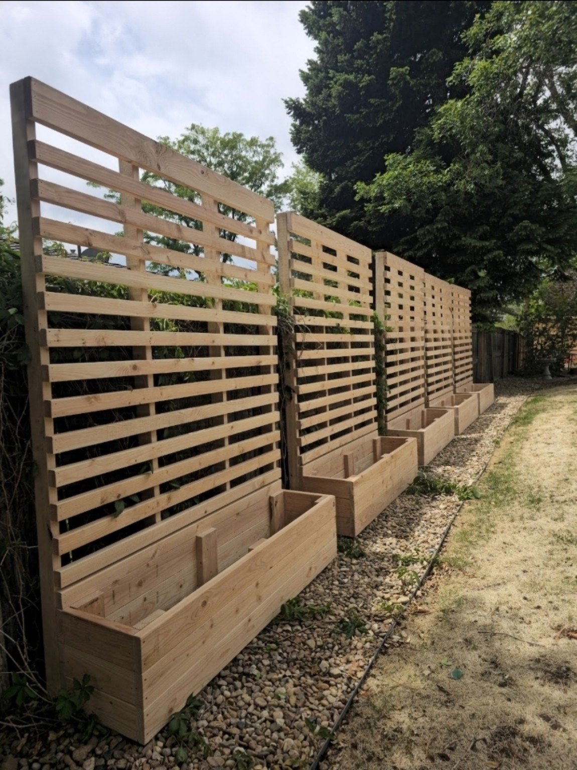 Custom outdoor trellis and planter installation